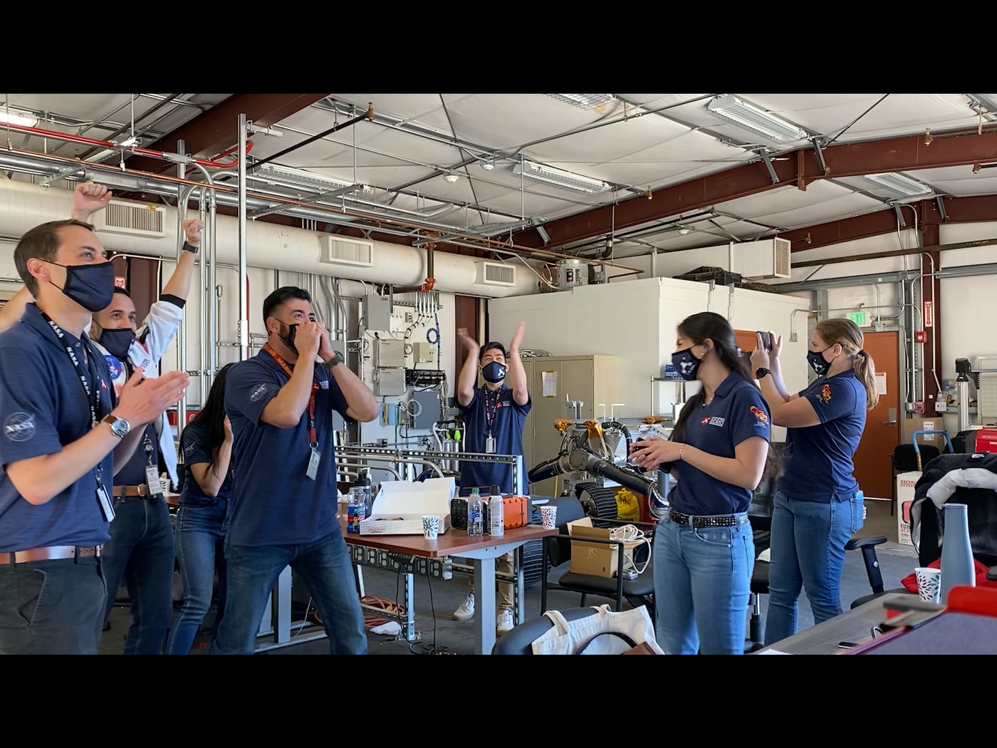 Cadence on an iPad, landscape: the Perseverance team celebrating the landing, in the player and sound controls in a centred column